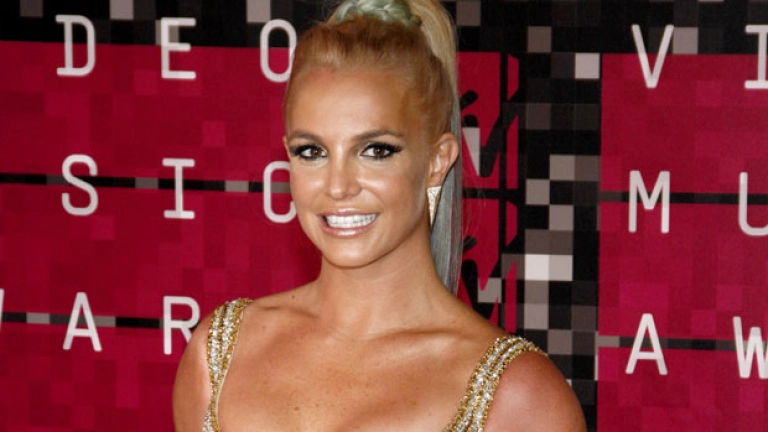 Britney Spears Rocks Gold Mini Dress After She’s Left ‘Mortified’ By Recent Singing Video