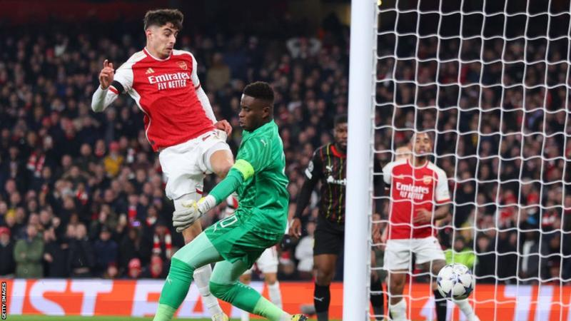 Arsenal reached the Champions League knockouts as group winners by thumping Lens at Emirates Stadium.